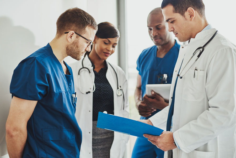 Group of doctors reading a document