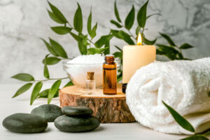 beauty treatment items for spa procedures on white wooden table