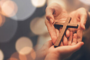 Woman's hand with cross