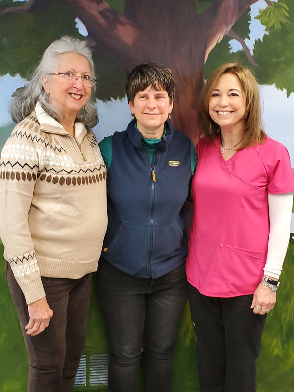 3 happy women standing with each other